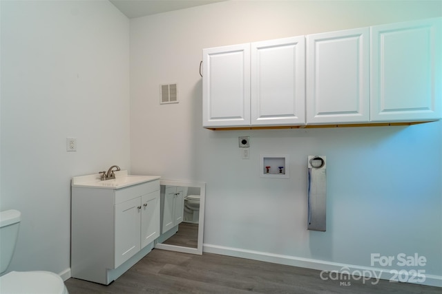 285 Painter Rd S, Cullowhee, NC 28723 - laundry area featuring baseboards, wood finished floors, hookup for a washing machine, and electric dryer hookup