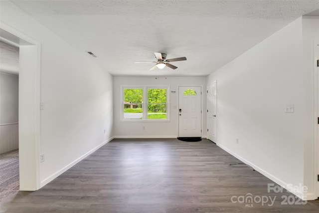 285 Painter Rd S, Cullowhee, NC 28723 - foyer entrance featuring a ceiling fan, wood finished floors, baseboards, and a textured ceiling