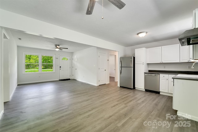 285 Painter Rd S, Cullowhee, NC 28723 - kitchen featuring stainless steel appliances, ceiling fan, baseboards, and dark countertops