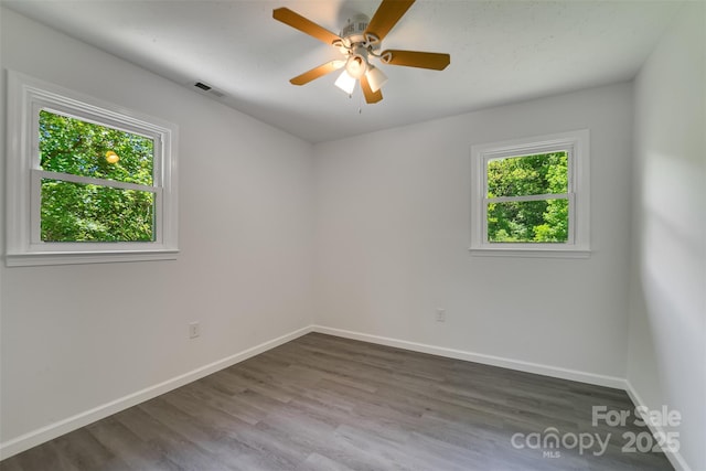 285 Painter Rd S, Cullowhee, NC 28723 - unfurnished room featuring baseboards, wood finished floors, and ceiling fan