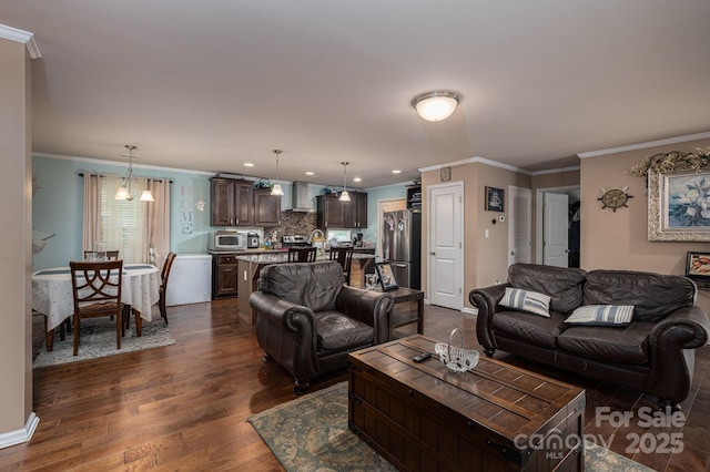 792 Carolina Mill Cir, Lincolnton, NC 28092 - living room with dark wood-style floors, ornamental molding, recessed lighting, and baseboards