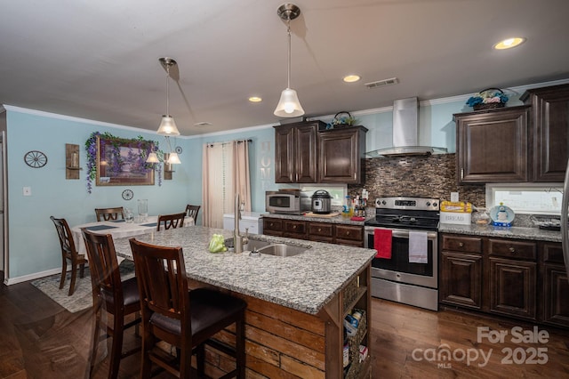 792 Carolina Mill Cir, Lincolnton, NC 28092 - kitchen featuring wall chimney exhaust hood, stainless steel appliances, a sink, crown molding, and an island with sink