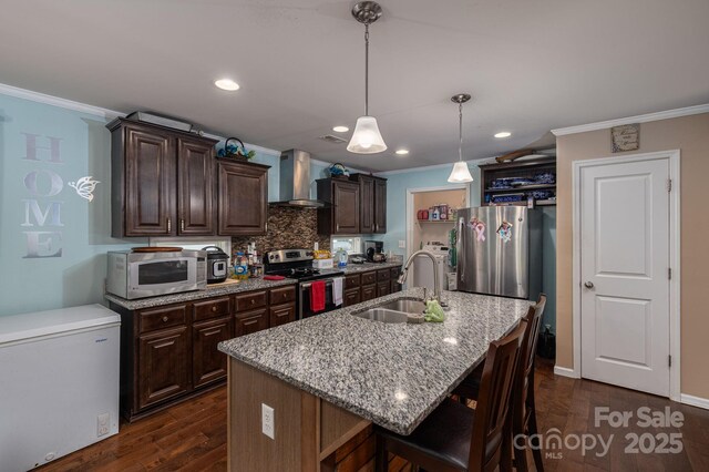 792 Carolina Mill Cir, Lincolnton, NC 28092 - kitchen featuring stainless steel appliances, a sink, wall chimney range hood, ornamental molding, and dark brown cabinetry