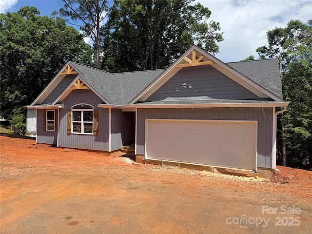 2027 Marquesas Ave, Tega Cay, SC 29708 - view of front of house featuring driveway, a shingled roof, and an attached garage