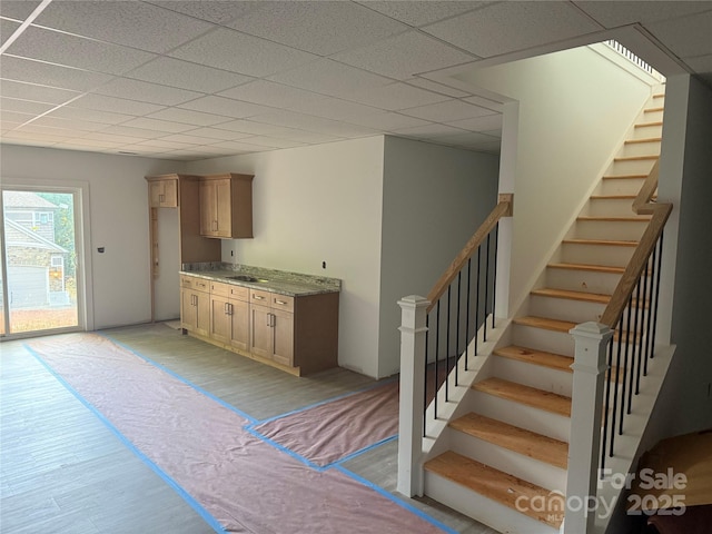 2027 Marquesas Ave, Tega Cay, SC 29708 - kitchen with light wood-style floors, a drop ceiling, and a sink