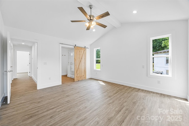2027 Marquesas Ave, Tega Cay, SC 29708 - unfurnished bedroom with light wood finished floors, a barn door, recessed lighting, and a ceiling fan