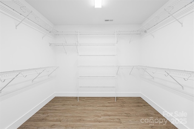 2027 Marquesas Ave, Tega Cay, SC 29708 - spacious closet featuring wood finished floors