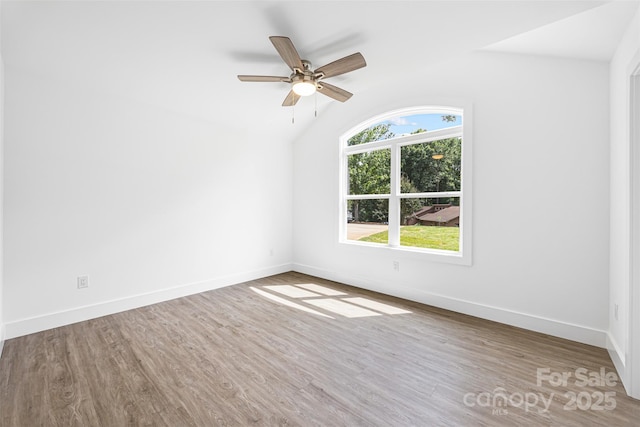 2027 Marquesas Ave, Tega Cay, SC 29708 - empty room featuring lofted ceiling, wood finished floors, and ceiling fan