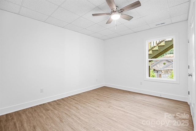 2027 Marquesas Ave, Tega Cay, SC 29708 - empty room featuring a drop ceiling, light wood-style flooring, and ceiling fan