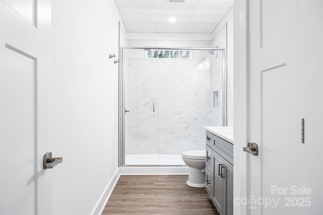 2027 Marquesas Ave, Tega Cay, SC 29708 - full bathroom with vanity, a marble finish shower, wood finished floors, a paneled ceiling, and recessed lighting