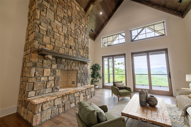 615 Macallan Dr Unit 321, Waynesville, NC 28786 - living room with wood ceiling with exposed beams, high vaulted ceiling, wood finished floors, baseboards, and a fireplace