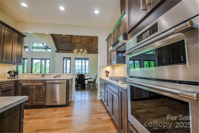 615 Macallan Dr Unit 321, Waynesville, NC 28786 - kitchen featuring stainless steel appliances, light countertops, recessed lighting, light wood finished floors, and plenty of natural light