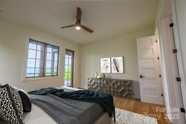 615 Macallan Dr Unit 321, Waynesville, NC 28786 - bedroom featuring wood finished floors, ceiling fan, and baseboards