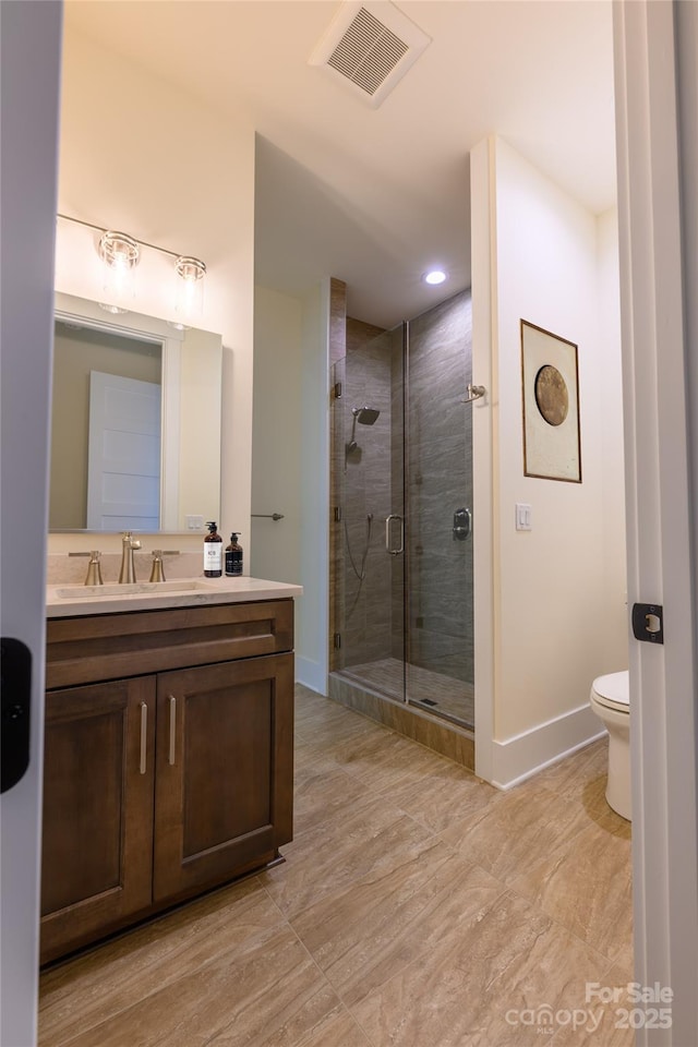 615 Macallan Dr Unit 321, Waynesville, NC 28786 - full bathroom featuring vanity, a shower stall, baseboards, toilet, and recessed lighting