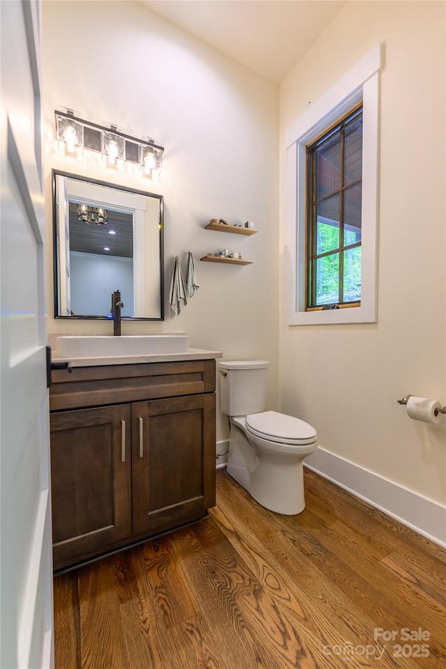 615 Macallan Dr Unit 321, Waynesville, NC 28786 - bathroom featuring vanity, wood finished floors, toilet, and baseboards