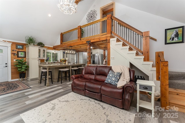 334 Arbra Mountain Way, Bostic, NC 28018 - living room with light wood-type flooring, stairway, a chandelier, high vaulted ceiling, and recessed lighting