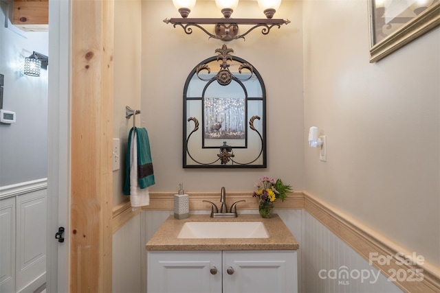 334 Arbra Mountain Way, Bostic, NC 28018 - bathroom featuring a wainscoted wall, vanity, and a decorative wall