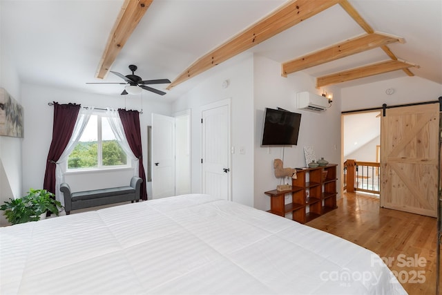 334 Arbra Mountain Way, Bostic, NC 28018 - bedroom featuring wood finished floors, a barn door, a wall unit AC, and ceiling fan