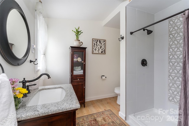 334 Arbra Mountain Way, Bostic, NC 28018 - full bath with vanity, wood finished floors, toilet, a tile shower, and baseboards