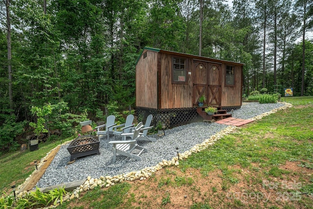 334 Arbra Mountain Way, Bostic, NC 28018 - view of shed with a fire pit