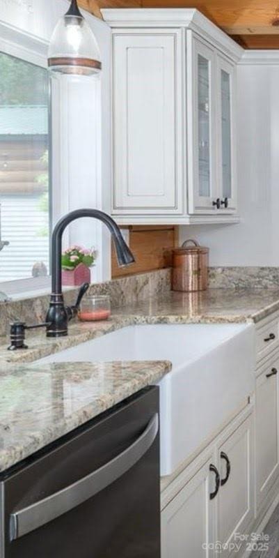 334 Arbra Mountain Way, Bostic, NC 28018 - kitchen featuring dishwasher, white cabinetry, glass insert cabinets, and light stone counters
