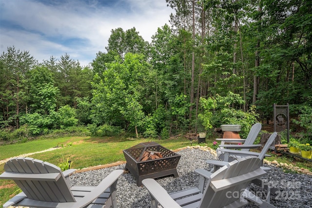 334 Arbra Mountain Way, Bostic, NC 28018 - view of patio / terrace with an outdoor fire pit and a view of trees