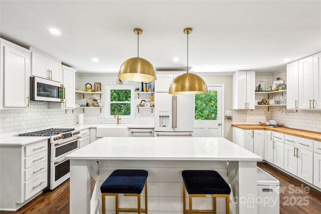106 Phifer St, Fort Mill, SC 29715 - kitchen with open shelves, white appliances, healthy amount of natural light, backsplash, and recessed lighting