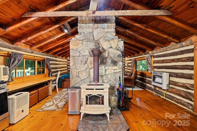 3739 Pickens Hwy, Rosman, NC 28772 - kitchen featuring heating unit, wood ceiling, a wood stove, and light wood-type flooring