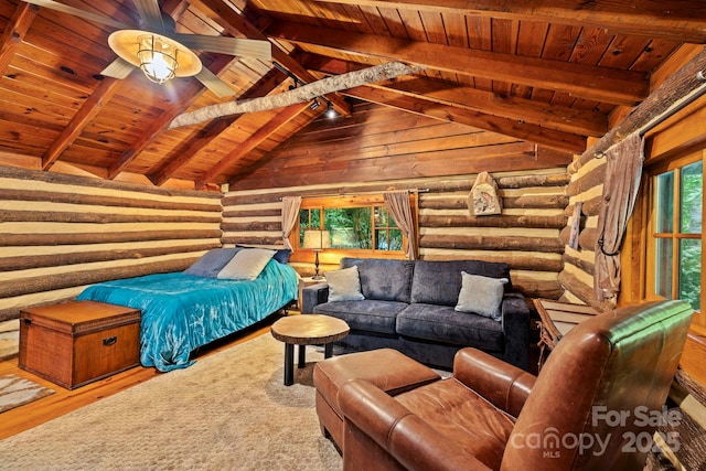 3739 Pickens Hwy, Rosman, NC 28772 - bedroom featuring wooden ceiling, log walls, and wood finished floors