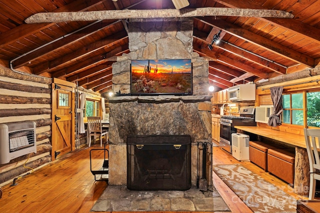 3739 Pickens Hwy, Rosman, NC 28772 - kitchen featuring heating unit, gas stove, wood ceiling, light wood finished floors, and healthy amount of natural light
