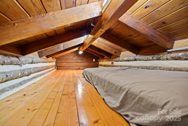 3739 Pickens Hwy, Rosman, NC 28772 - bedroom with wooden ceiling with exposed beams, hardwood / wood-style floors, and wood walls