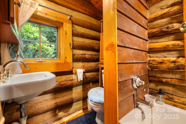 3739 Pickens Hwy, Rosman, NC 28772 - bathroom featuring toilet, a bathtub, and rustic walls