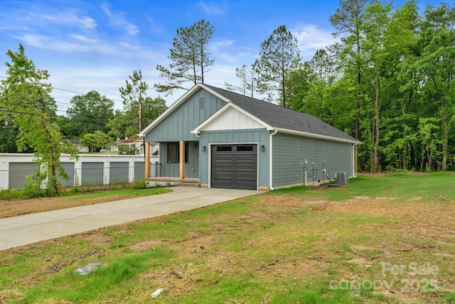 101 Churchill Dr, Kings Mountain, NC 28086 - view of front of property with board and batten siding, a garage, concrete driveway, and cooling unit