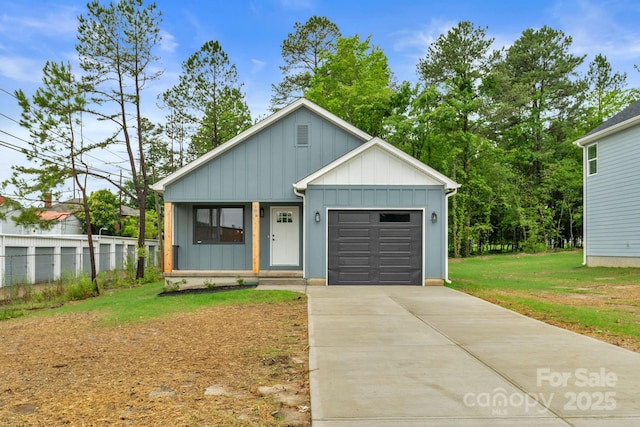 101 Churchill Dr, Kings Mountain, NC 28086 - view of front facade featuring concrete driveway, board and batten siding, an attached garage, and covered porch