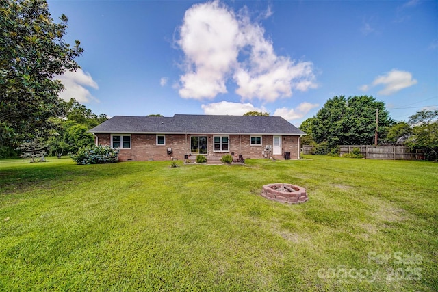 801 Witmore Rd, Wingate, NC 28174 - rear view of house with a fire pit and brick siding