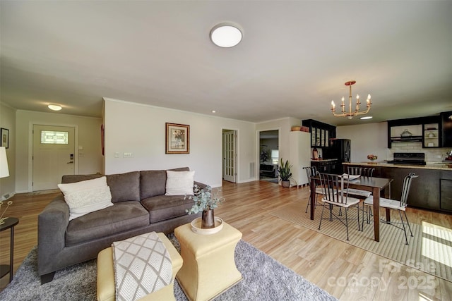 801 Witmore Rd, Wingate, NC 28174 - living area with a chandelier, light wood finished floors, and baseboards