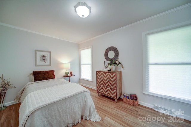 801 Witmore Rd, Wingate, NC 28174 - bedroom with crown molding, light wood-type flooring, and baseboards