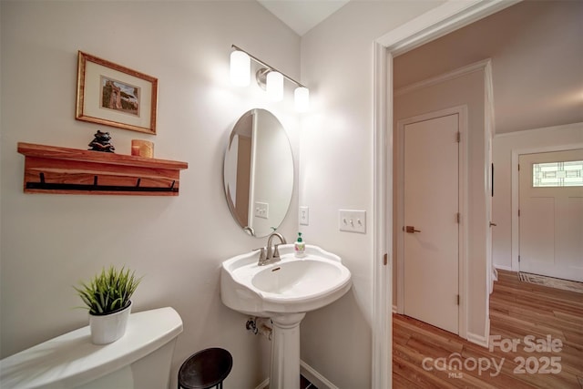 801 Witmore Rd, Wingate, NC 28174 - bathroom featuring wood finished floors, toilet, and baseboards