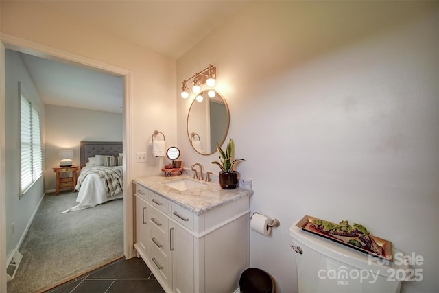 801 Witmore Rd, Wingate, NC 28174 - bathroom with vanity, toilet, connected bathroom, and tile patterned flooring