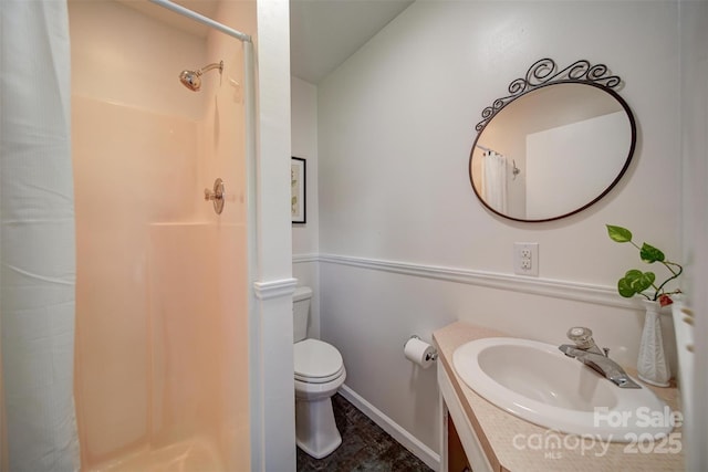 801 Witmore Rd, Wingate, NC 28174 - full bathroom featuring vanity, a shower with curtain, toilet, and baseboards