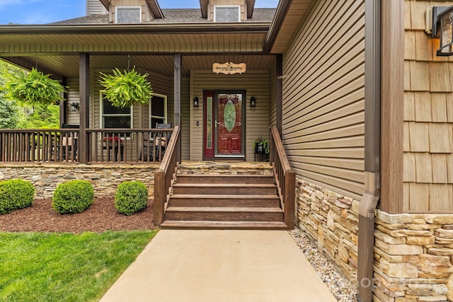 21 School House Rd, Pisgah Forest, NC 28768 - entrance to property featuring covered porch, roof with shingles, and stone siding