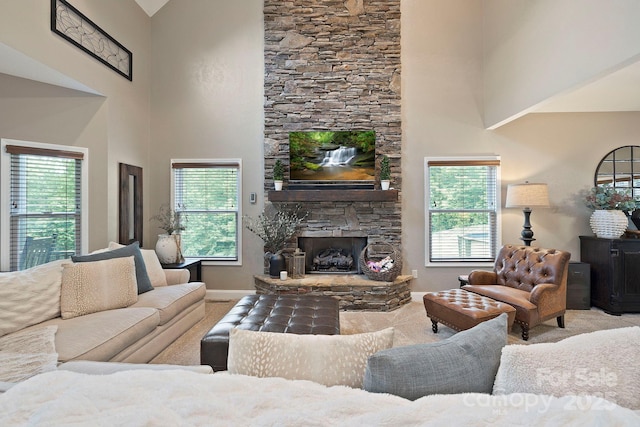 21 School House Rd, Pisgah Forest, NC 28768 - carpeted living area with a high ceiling and a fireplace