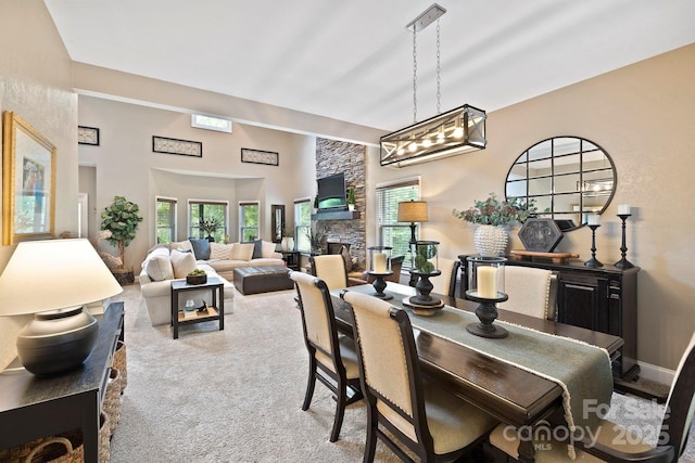 21 School House Rd, Pisgah Forest, NC 28768 - dining room featuring a stone fireplace and carpet flooring