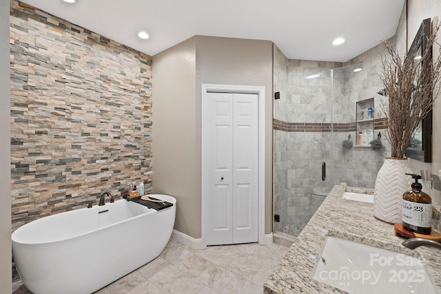 21 School House Rd, Pisgah Forest, NC 28768 - full bath with a shower stall, a freestanding tub, a closet, double vanity, and recessed lighting