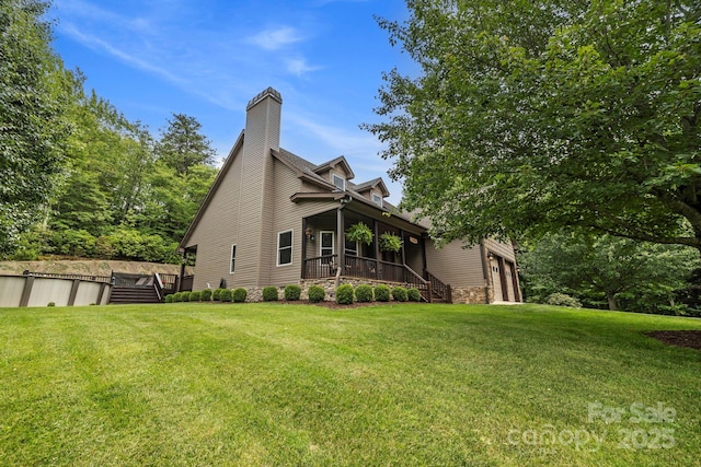 21 School House Rd, Pisgah Forest, NC 28768 - view of side of home featuring a yard and a chimney