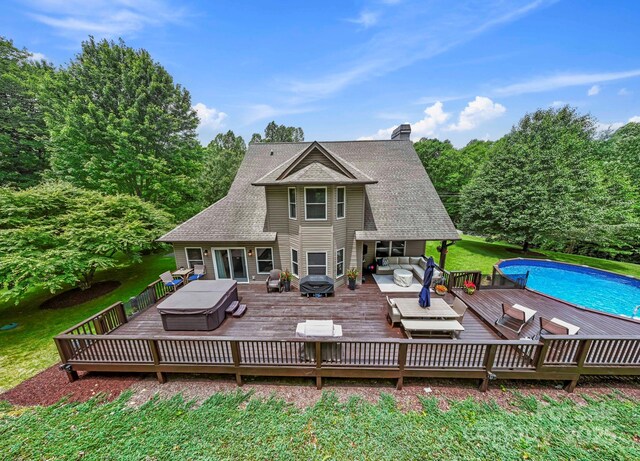 21 School House Rd, Pisgah Forest, NC 28768 - rear view of property with an outdoor hangout area, a wooden deck, an outdoor pool, a chimney, and roof with shingles