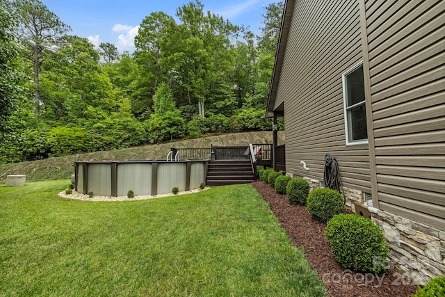 21 School House Rd, Pisgah Forest, NC 28768 - view of grassy yard with a wooden deck and an outdoor pool
