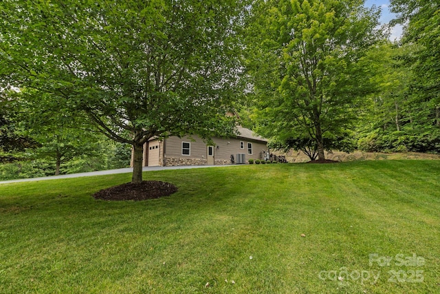 21 School House Rd, Pisgah Forest, NC 28768 - view of green lawn featuring an attached garage