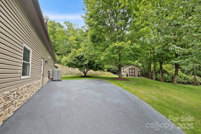 21 School House Rd, Pisgah Forest, NC 28768 - view of patio with a storage unit