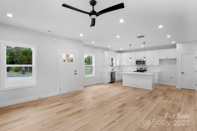 103 Churchill Dr, Kings Mountain, NC 28086 - kitchen with stainless steel appliances, healthy amount of natural light, a ceiling fan, white cabinetry, and recessed lighting